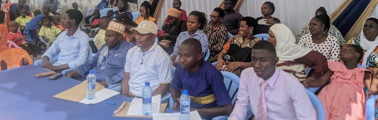 Amosi Schools community leaders and families gathered at a school event